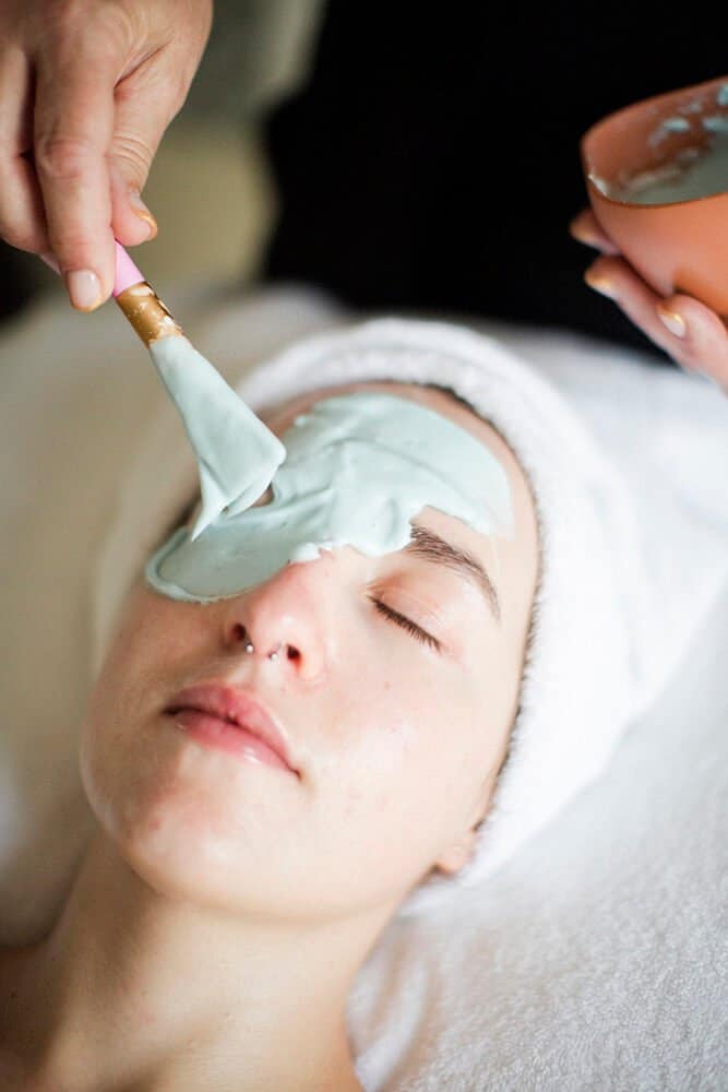 marine algae facial mask being applied to a young woman at our spa