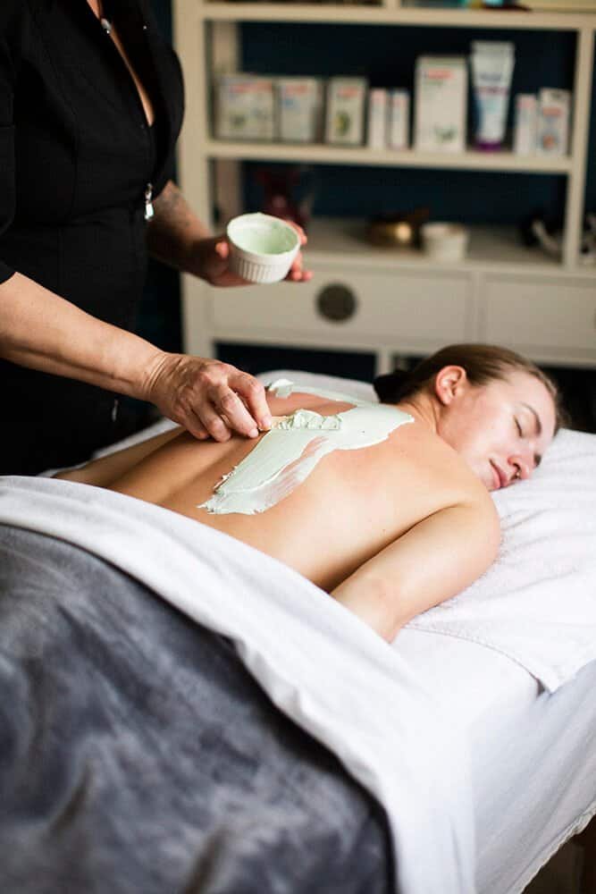 marine algae body wrap being applied to a woman in our spa